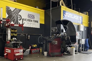 Tire changer and wheel balancer in the shop